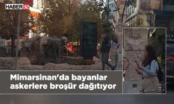 Mimarsinan'da bayanlar askerlere broşür dağıtıyor